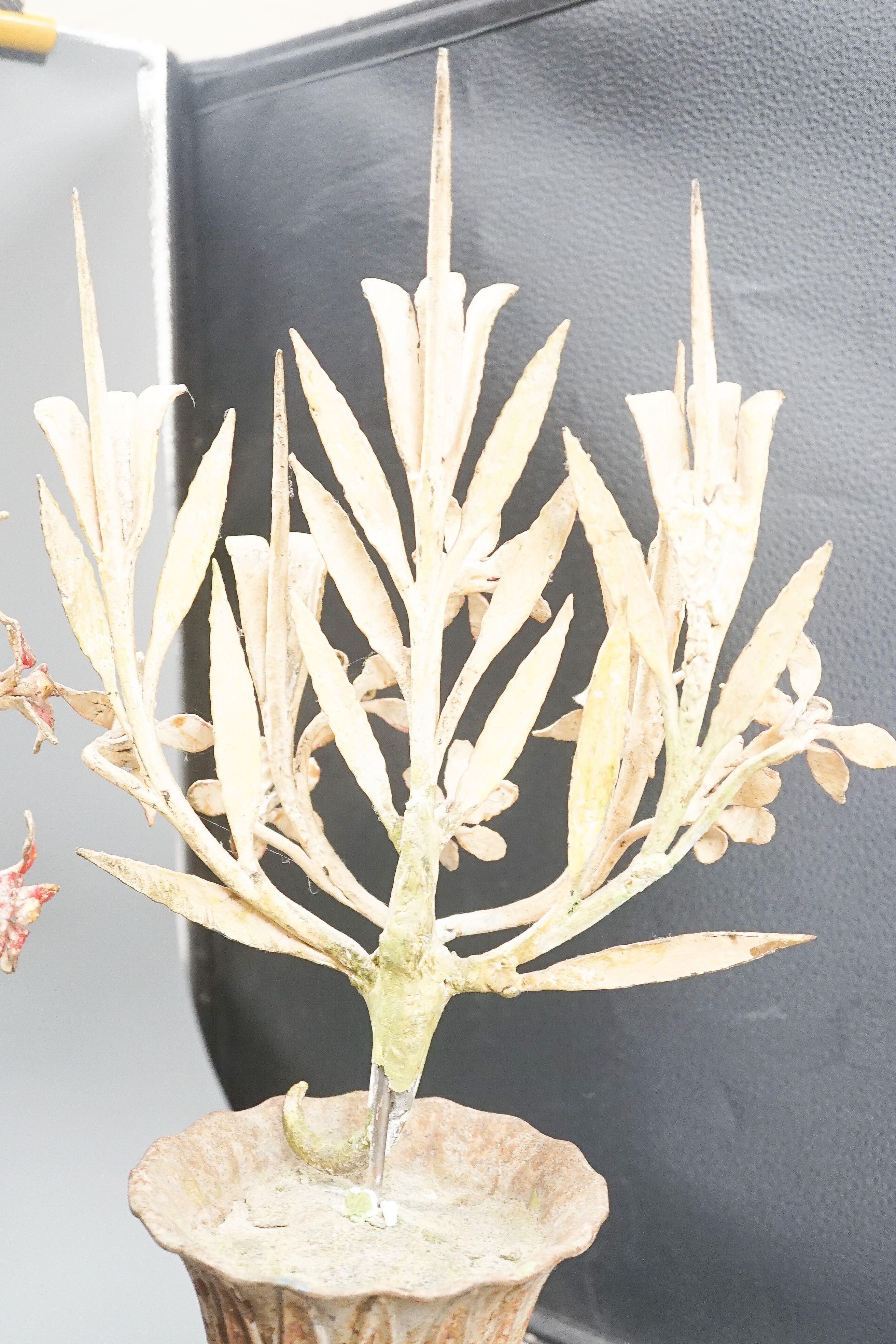 A pair of late 19th/early 20th century painted wrought iron, composition and cast iron 'flower' vases 60cm